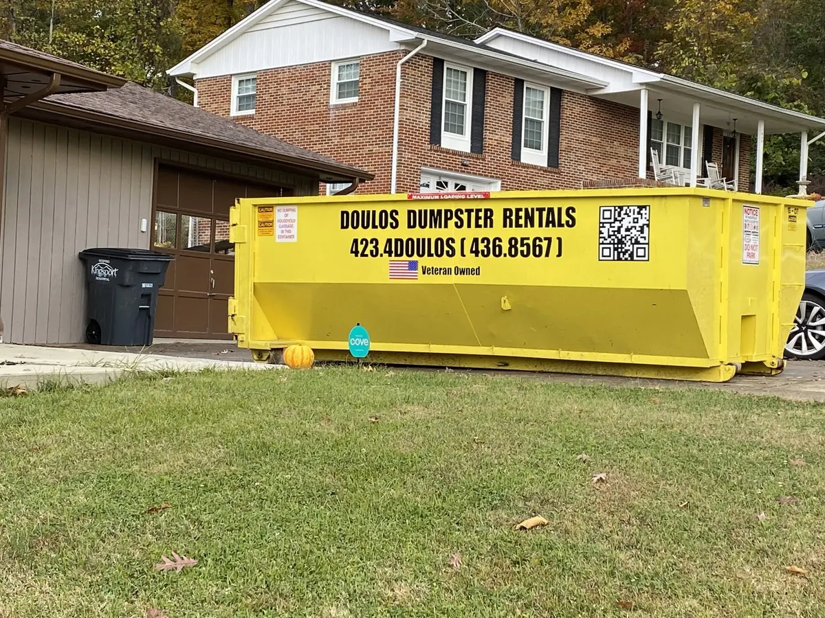 15 yard dumpster on a residential driveway