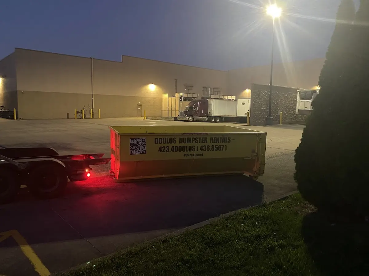 Dumpster being delivered after hours