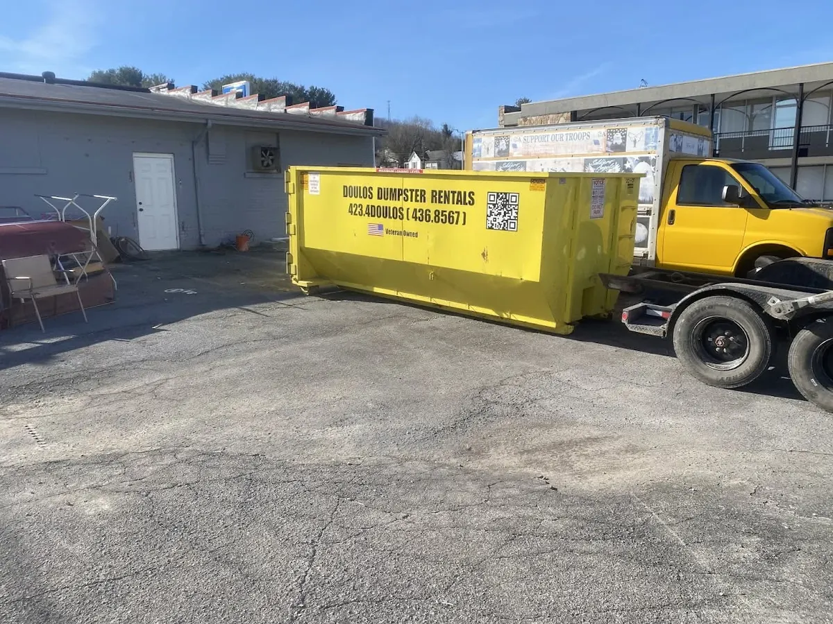 Dumpster behind a business during a renovation