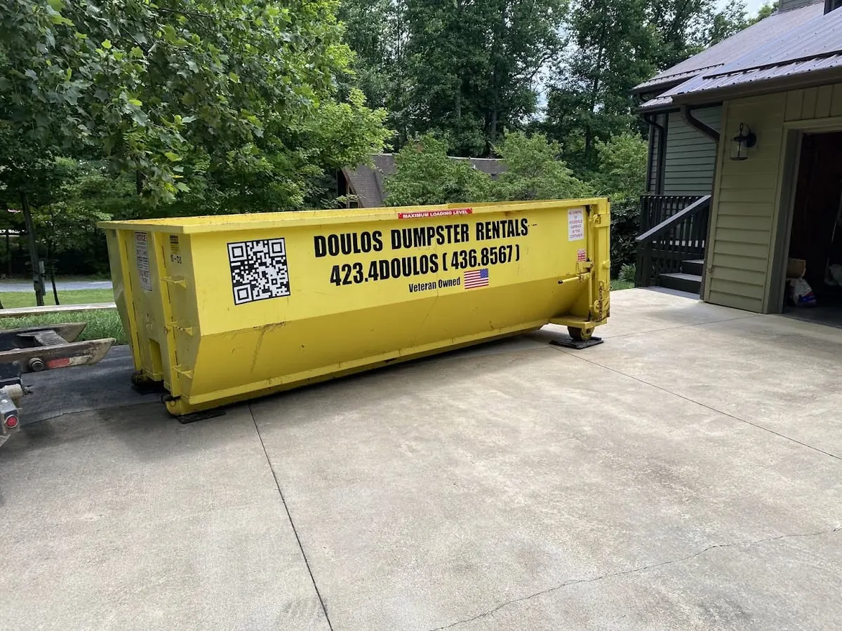 Container sitting on protection mats in a driveway