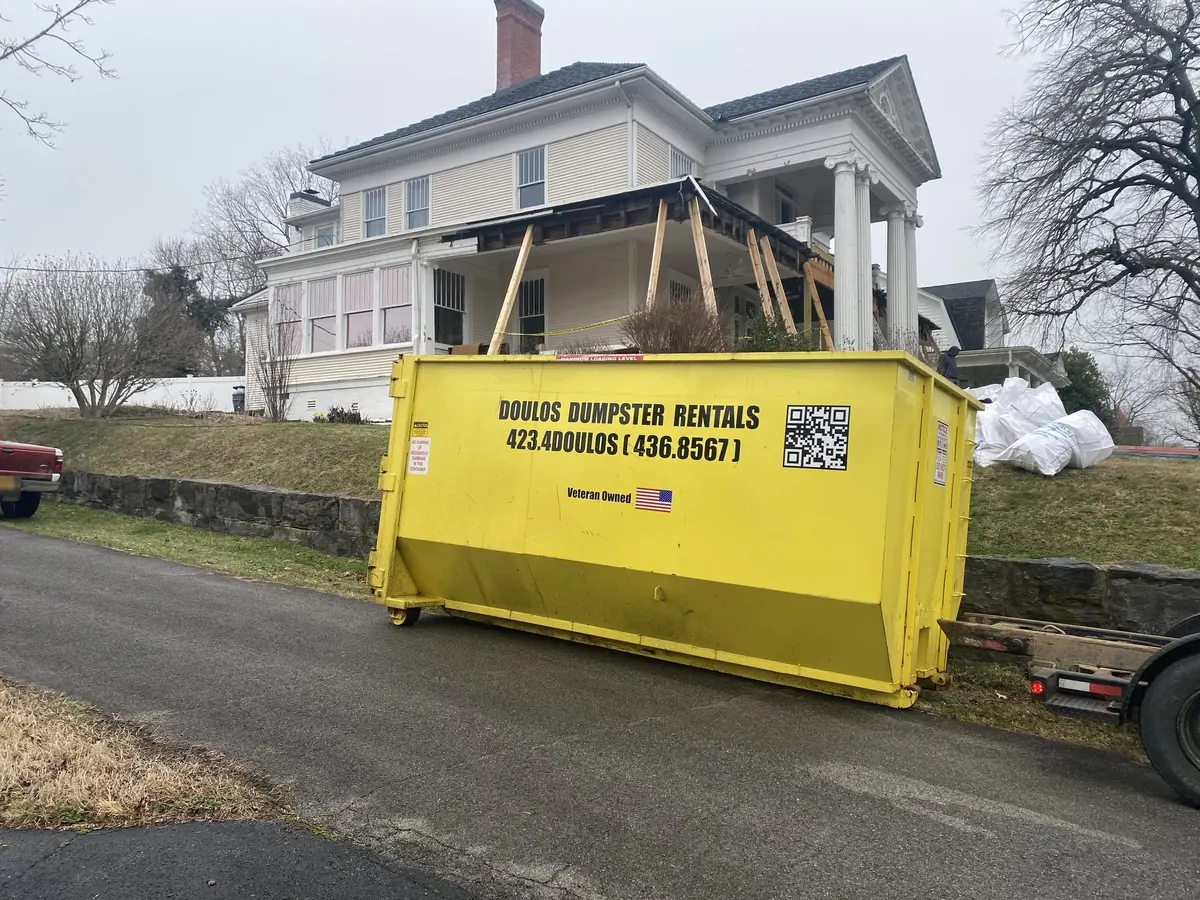 Dumpster at a home during storm damage repair