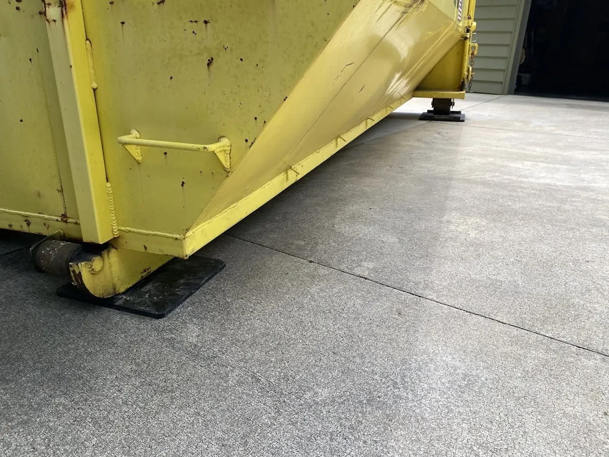 Protection mats laid on a concrete driveway