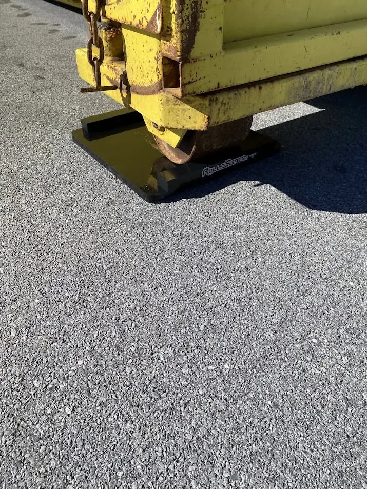 Driveway protection mat under a container skid